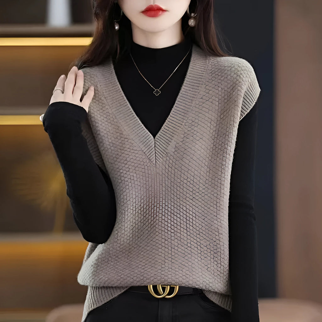 V-neck sleeveless knitted pullover vest with a raised 3D pattern in acrylic fibre, shown in camel colour.
