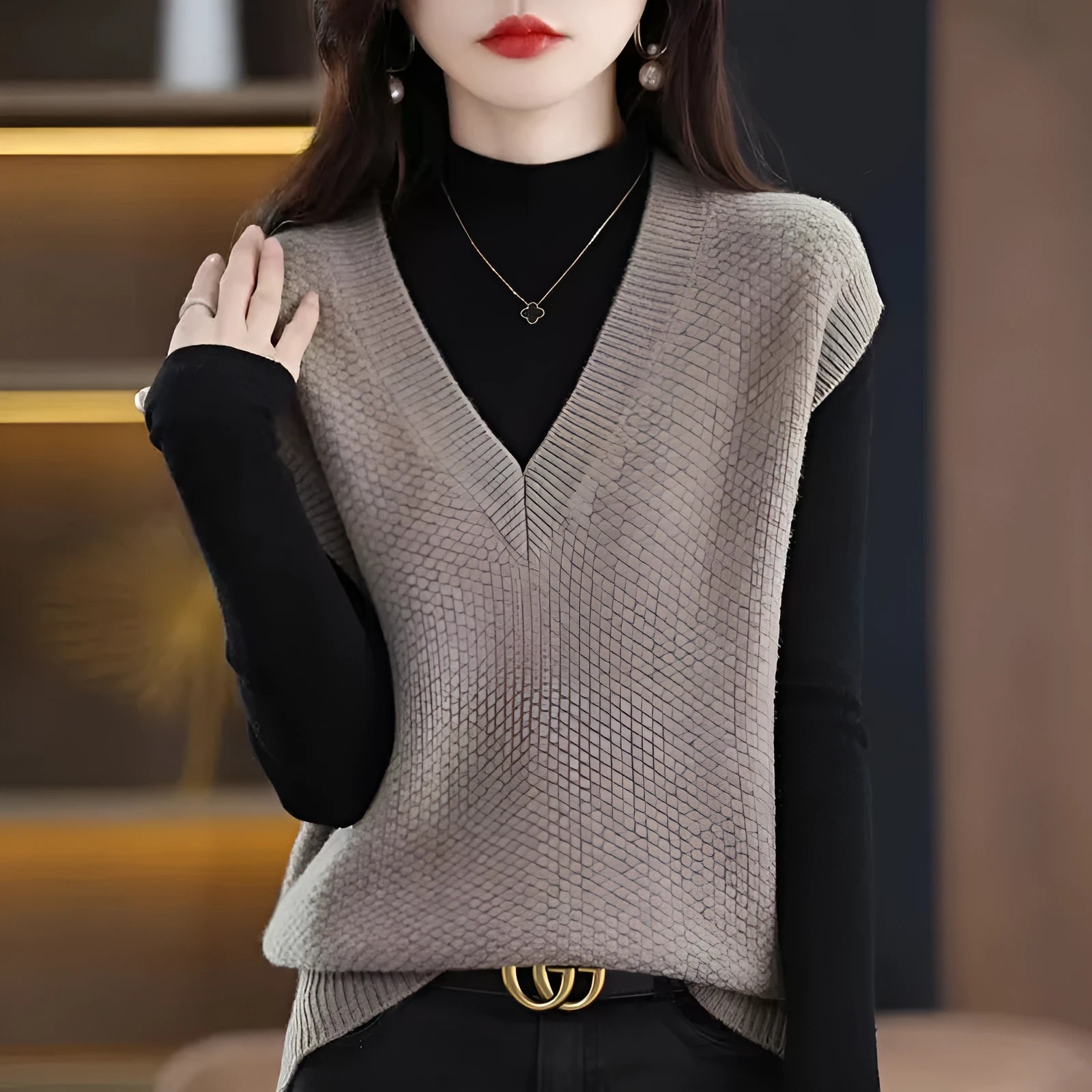 V-neck sleeveless knitted pullover vest with a raised 3D pattern in acrylic fibre, shown in camel colour.