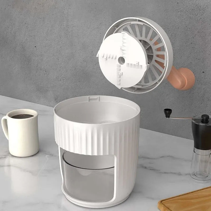 Hand-cranked ice shaving machine in green or orange with removable ice box, PP ABS and 304 stainless steel construction