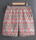 Men's casual polyester shorts in a camouflage pattern, featuring an elastic waistband.
