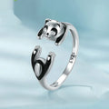 Adjustable sterling silver panda open ring with white gold plating on a finger
