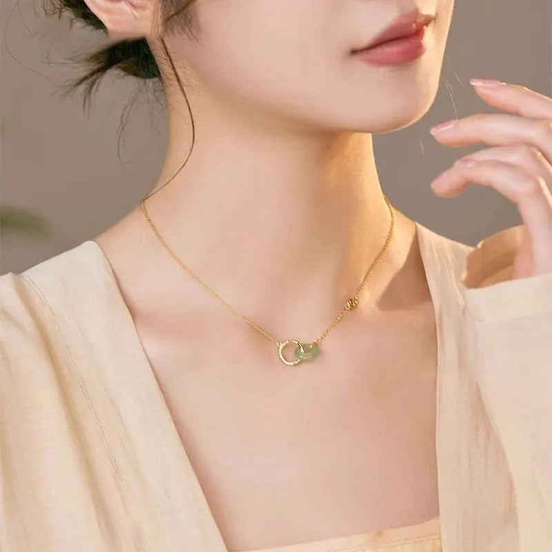 Sterling silver bamboo joint peace buckle necklace on an adjustable O-ring chain with a geometric pearl detail.