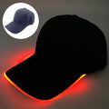 Halloween LED light-up baseball cap showing pumpkin smile yellow light pattern on a black cloth cap with adjustable strap.