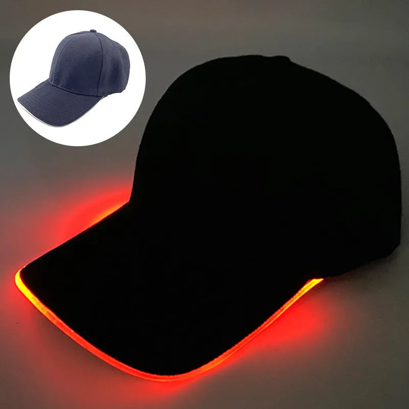 Halloween LED light-up baseball cap showing pumpkin smile yellow light pattern on a black cloth cap with adjustable strap.