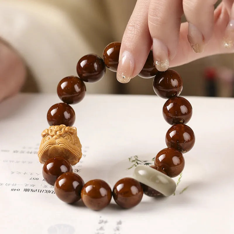Hand-woven 13mm lion bead bracelet in ivory nut, sandalwood or yellow gradient bodhi style