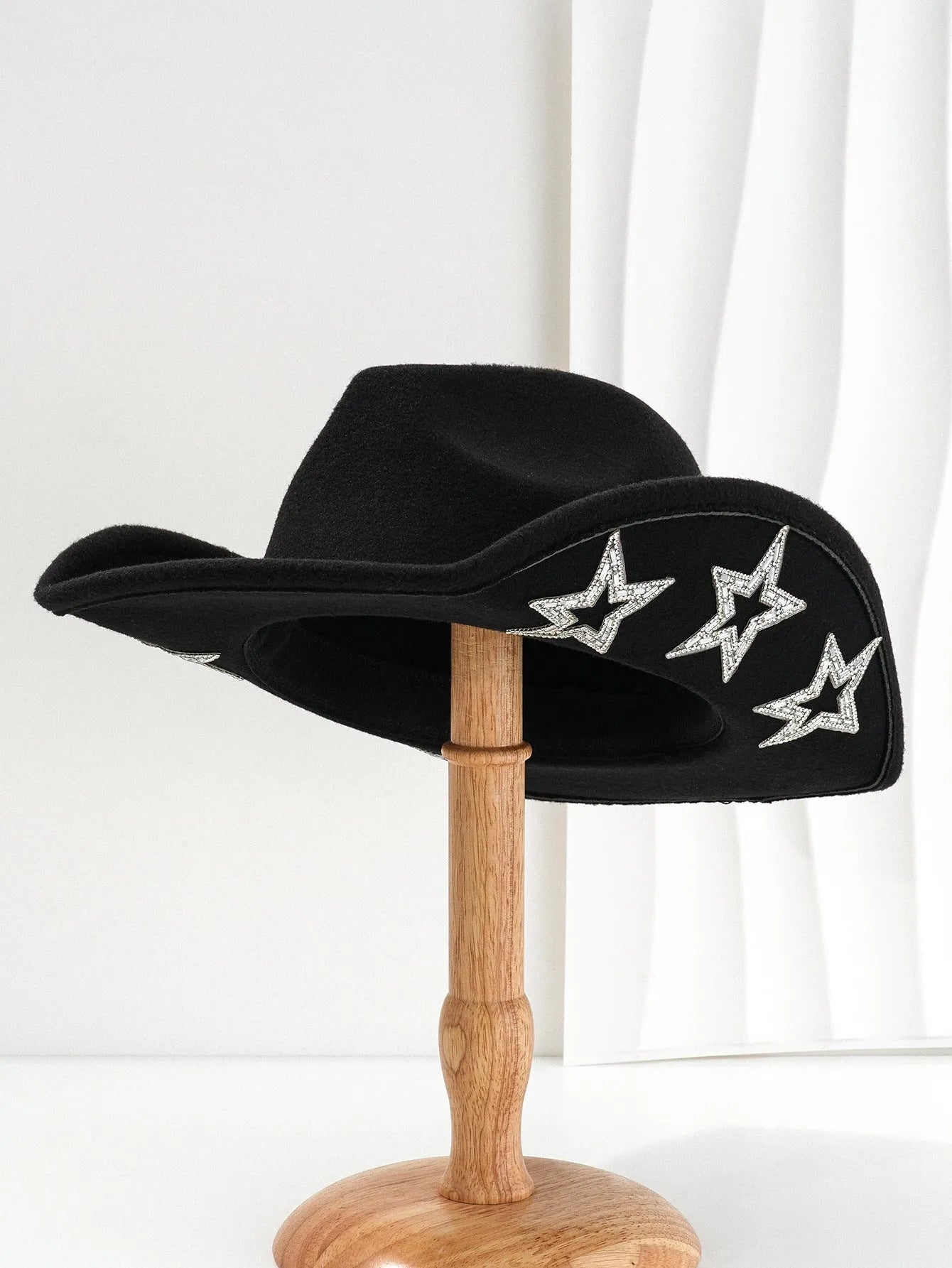 Beige woven polyester western-style top hat with a conical crown on a neutral background.