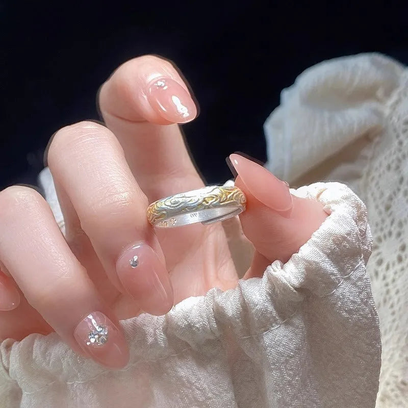 Open mouth silver gold ring with geometric Chinese Xiangyun cloud pattern.