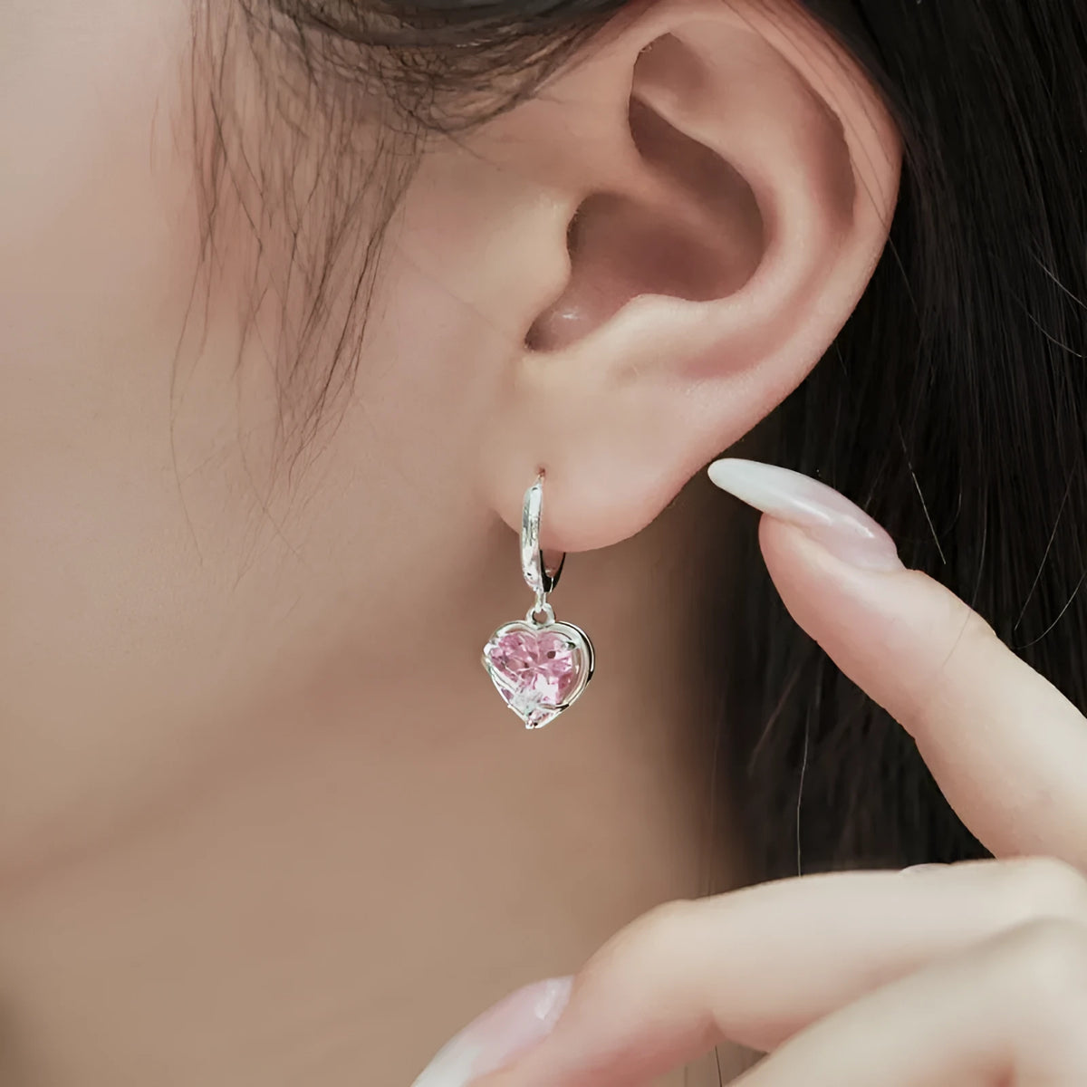 S925 sterling silver heart shaped earrings for women in pink electroplated finish on white background