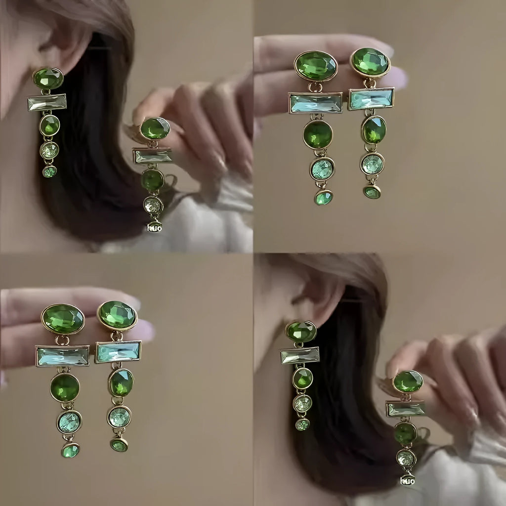 A pair of green gradient retro earrings with a geometric shape, tassel detail, and zircon inlay on an alloy base.