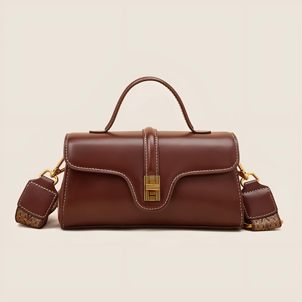 Cambridge-style leather messenger bag in clamshell design with lock detail and internal compartments