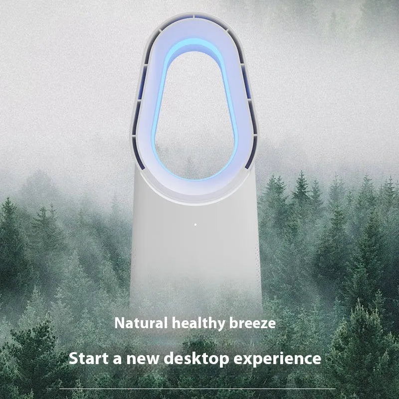 White bladeless tower fan with touch controls and remote on wooden desk