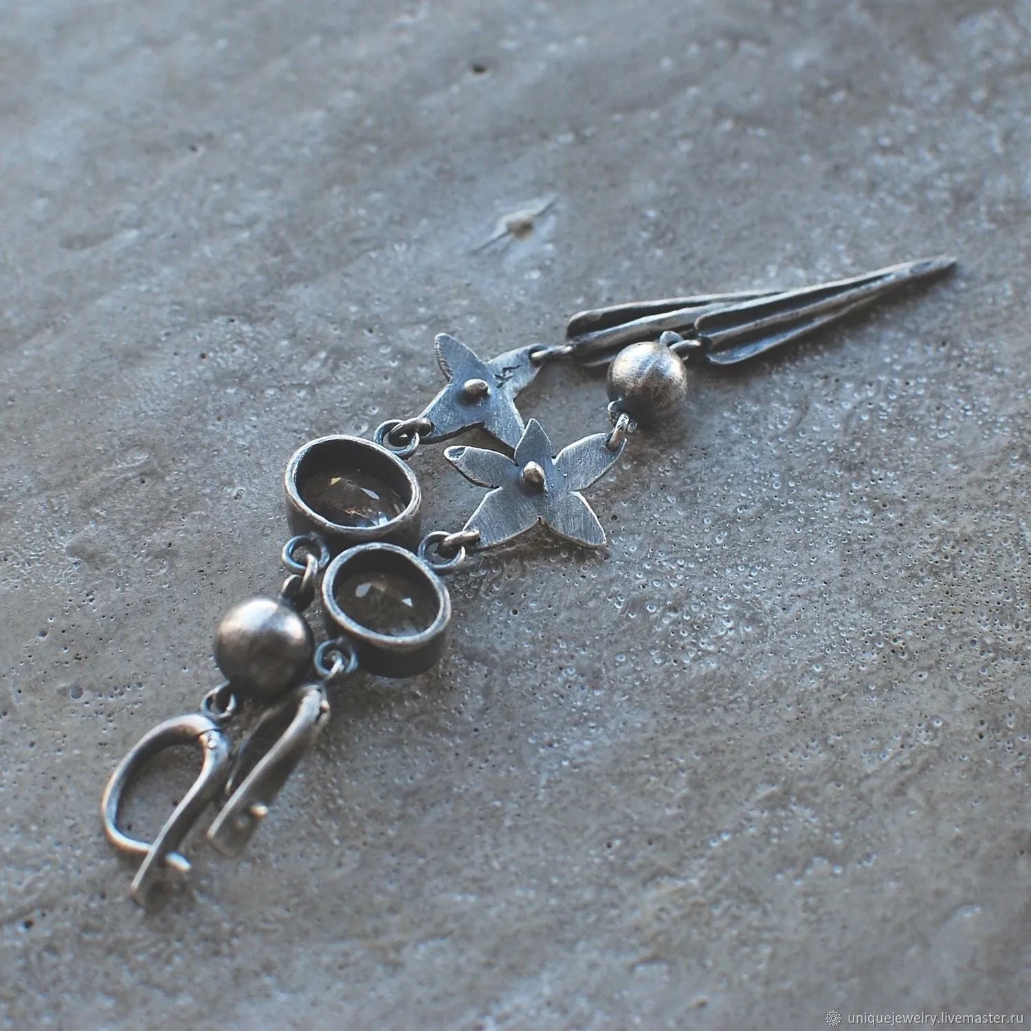 Geometric XINGX pendant earrings in antique silver with rhinestone detailing
