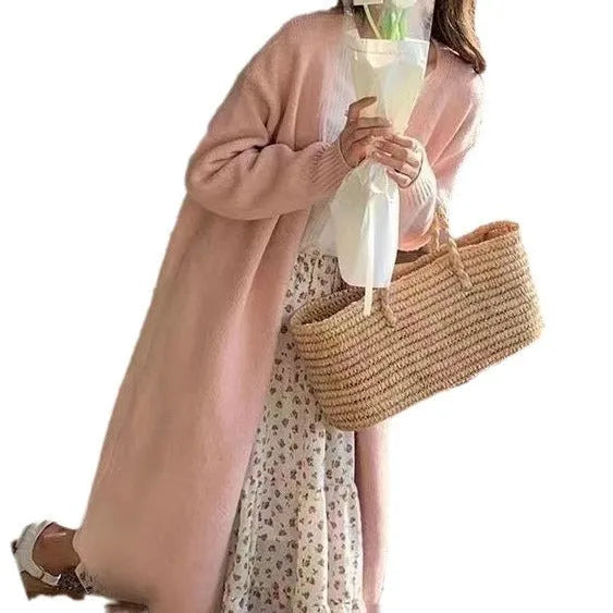 Women's loose fit grey knitted V-neck cardigan coat with long sleeves, shown mid-length.