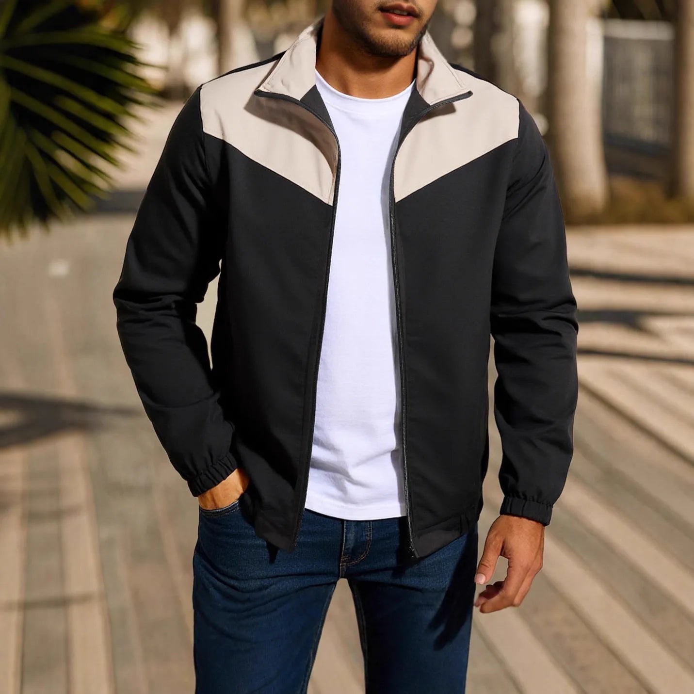 Men's windproof high collar jacket in polyester with a colour-matching zip and raglan sleeves.