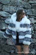 Loose-fitting women's faux fur coat with a hood in brown, shown in streetwear style.