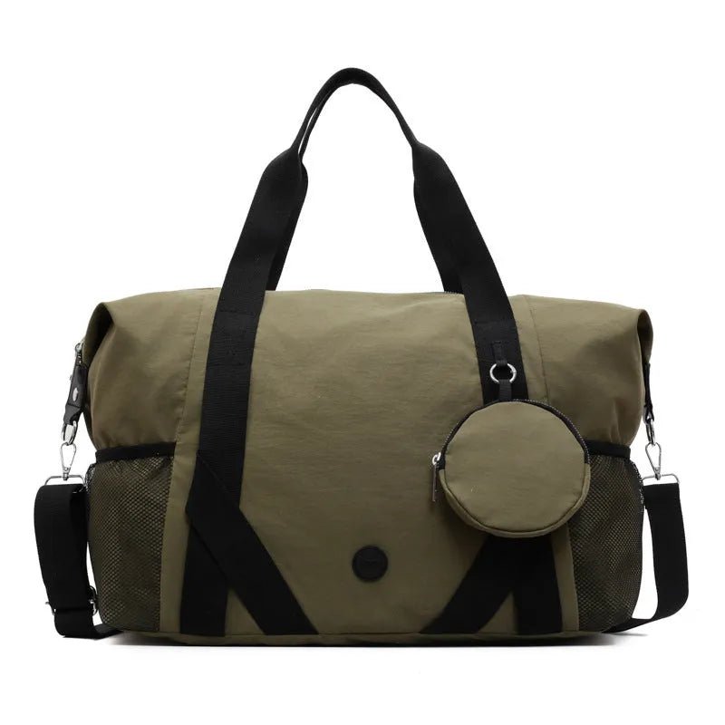 Lightweight black and green Oxford cloth gym bag with polyester lining.