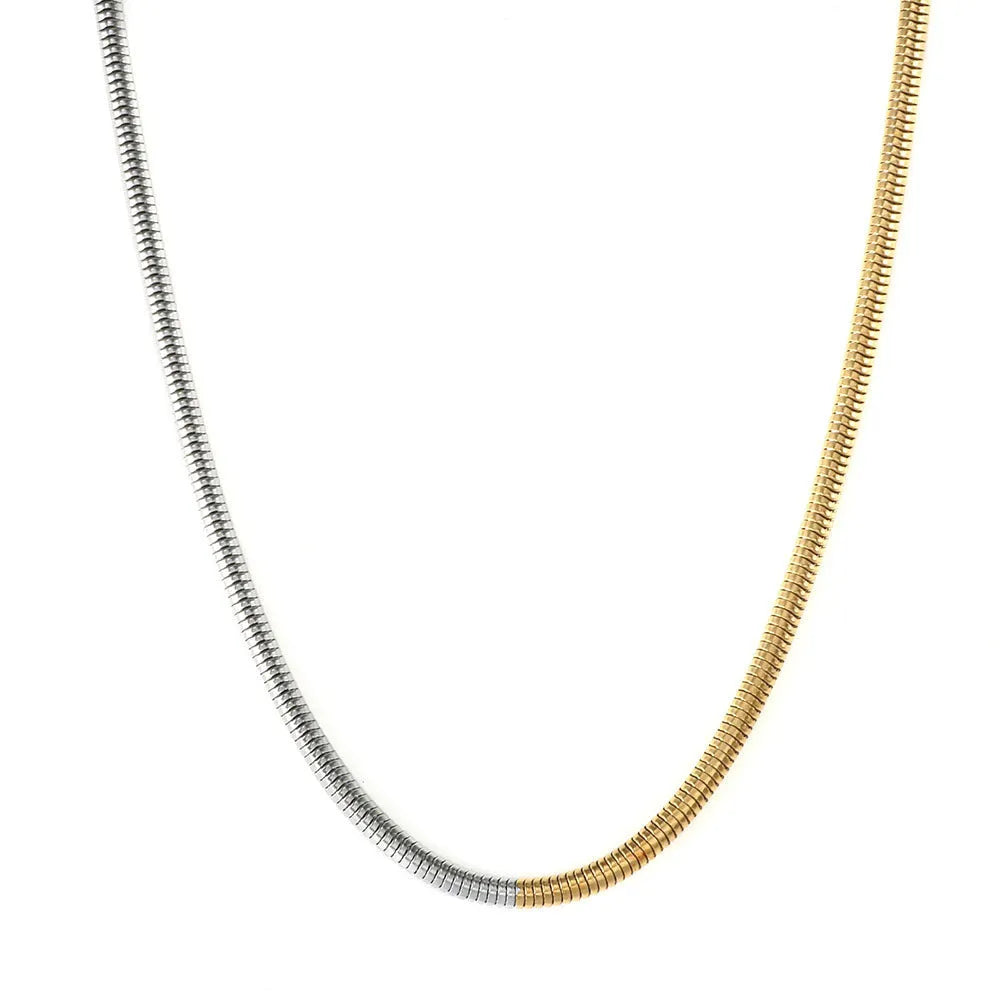 Gold-colour women's snake bones chain necklace with geometric alloy pendant, 3mm wide.