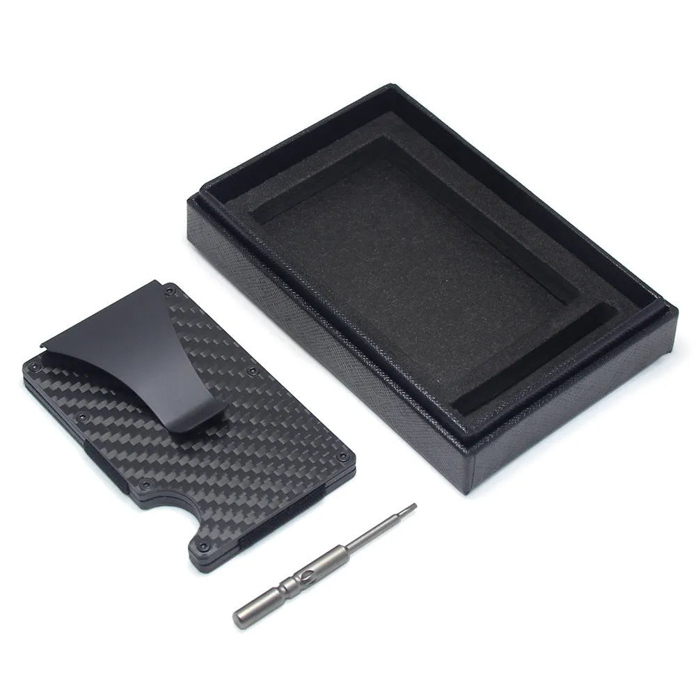 Slim black carbon fibre card holder wallet with geometric design on a gift box.
