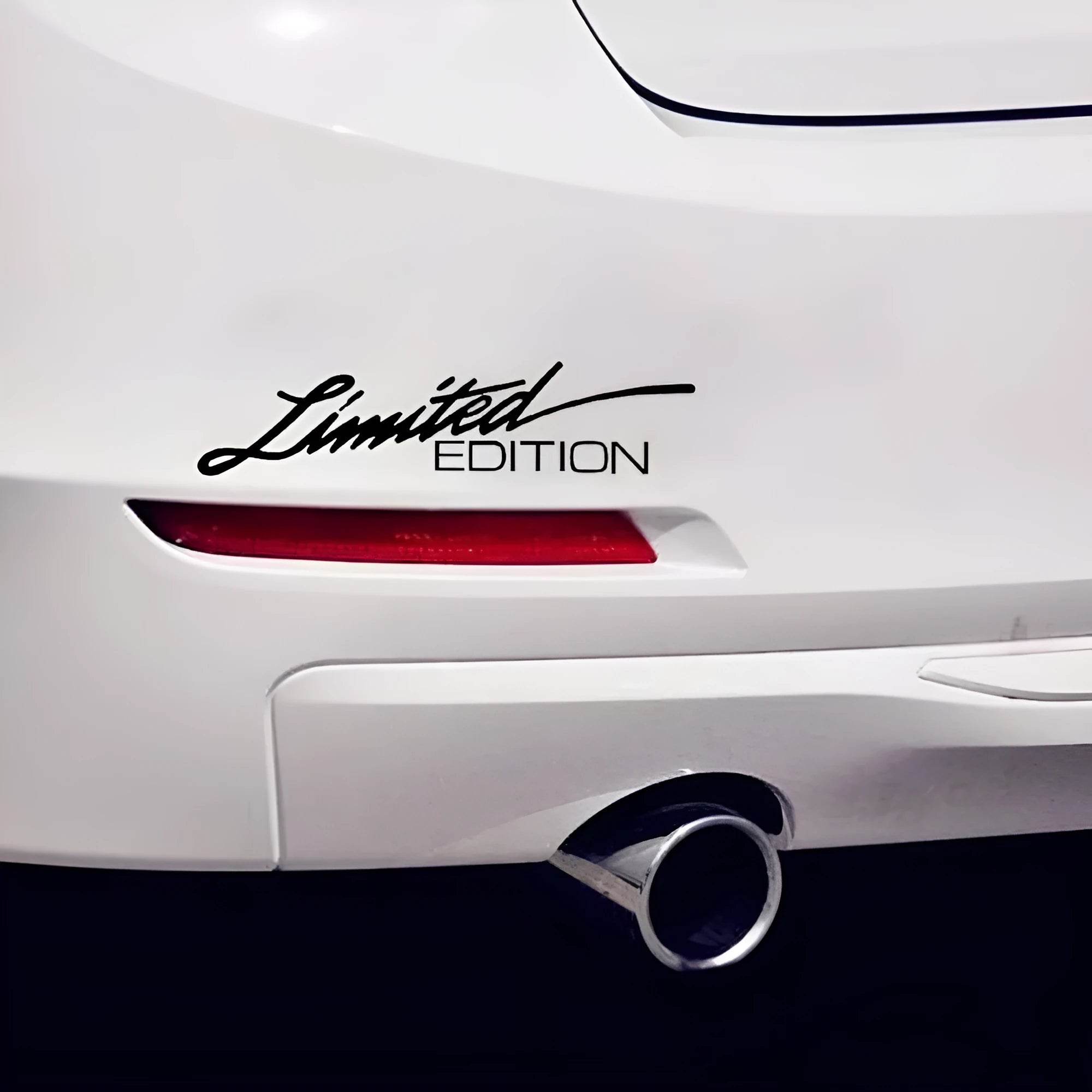 British reflective plastic bumper sticker in black, white, or colourful, showing 16cm by 3.8cm size.