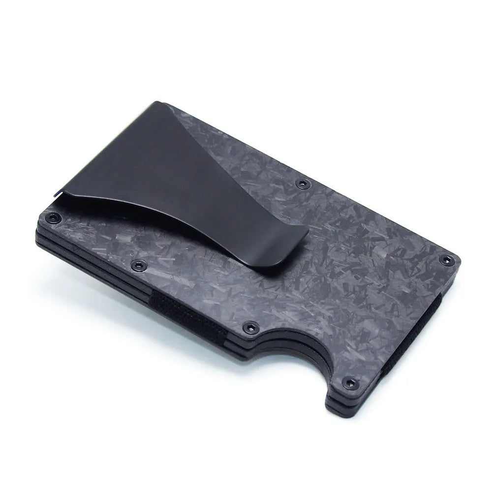 Slim black carbon fibre card holder wallet with geometric design on a gift box.