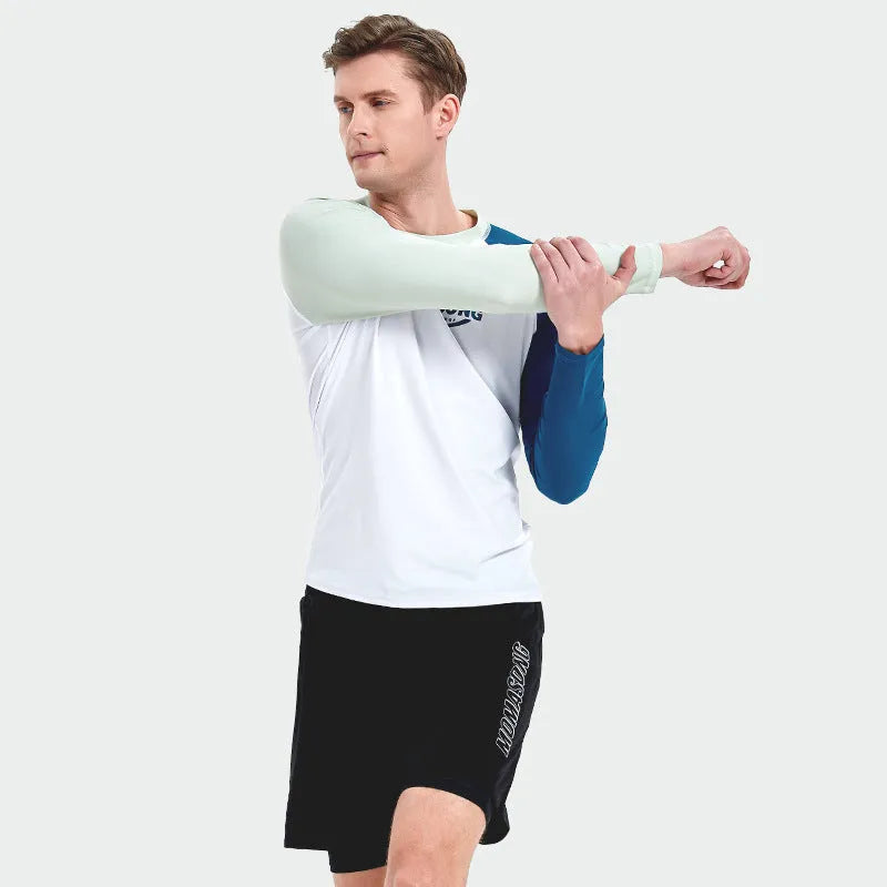 Men's white long-sleeved swim top with colour-matched beach swim trunks set on a beach.