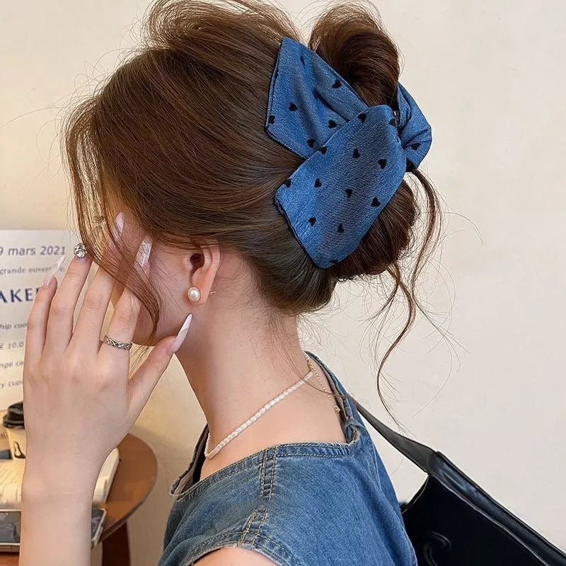 Handmade triangle grip hair clip with denim bow detailing in fabric and acrylic