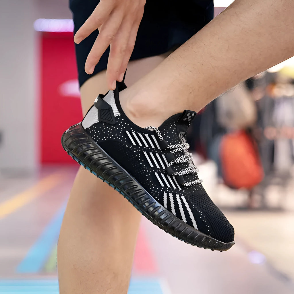 Men's white breathable flying fabric sports shoes with low-top platform design and round toe.