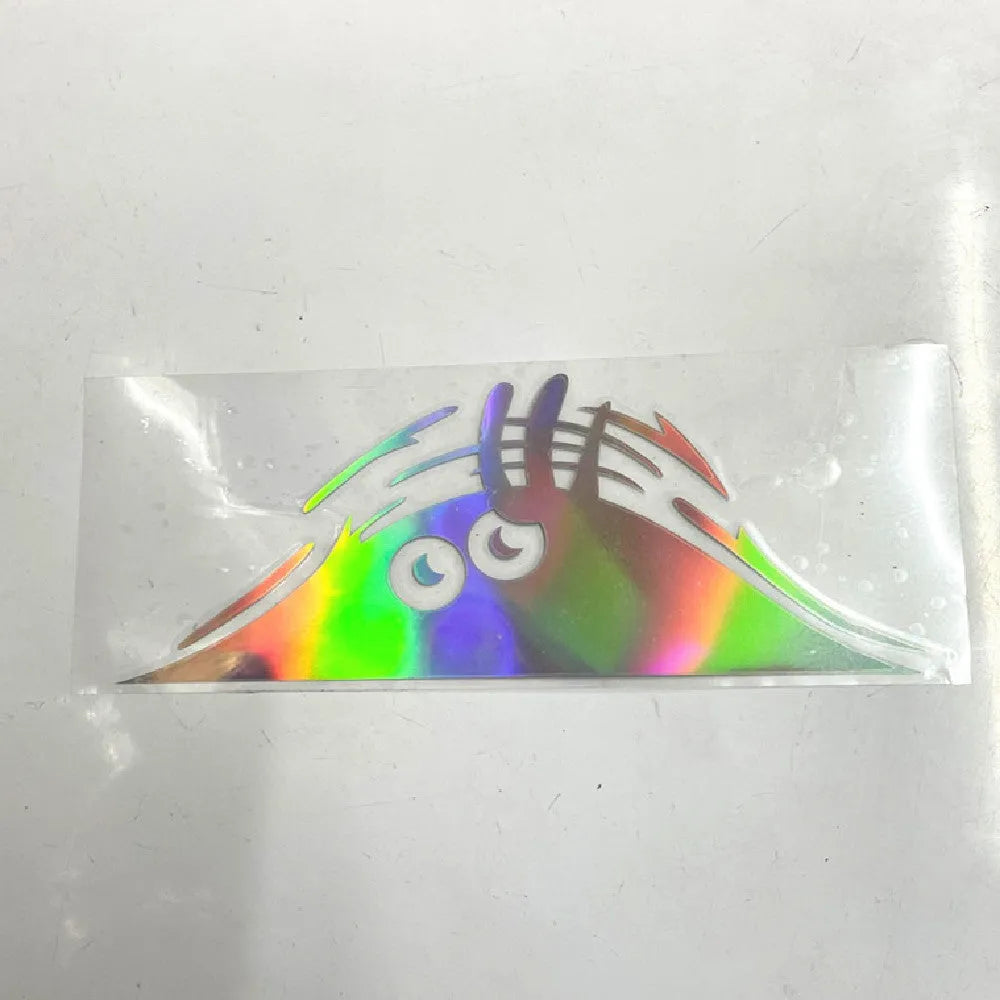 Self-adhesive body sticker showing colourful smiley face design, 19cm by 7cm.
