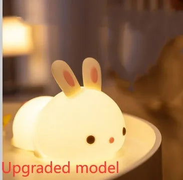 Rabbit silicone pat night light with seven-colour LED on a study desk