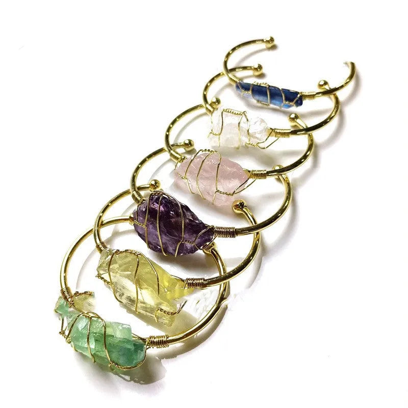 Natural crystal rough stone bracelet with gold winding geometric design showing colour mixing finish