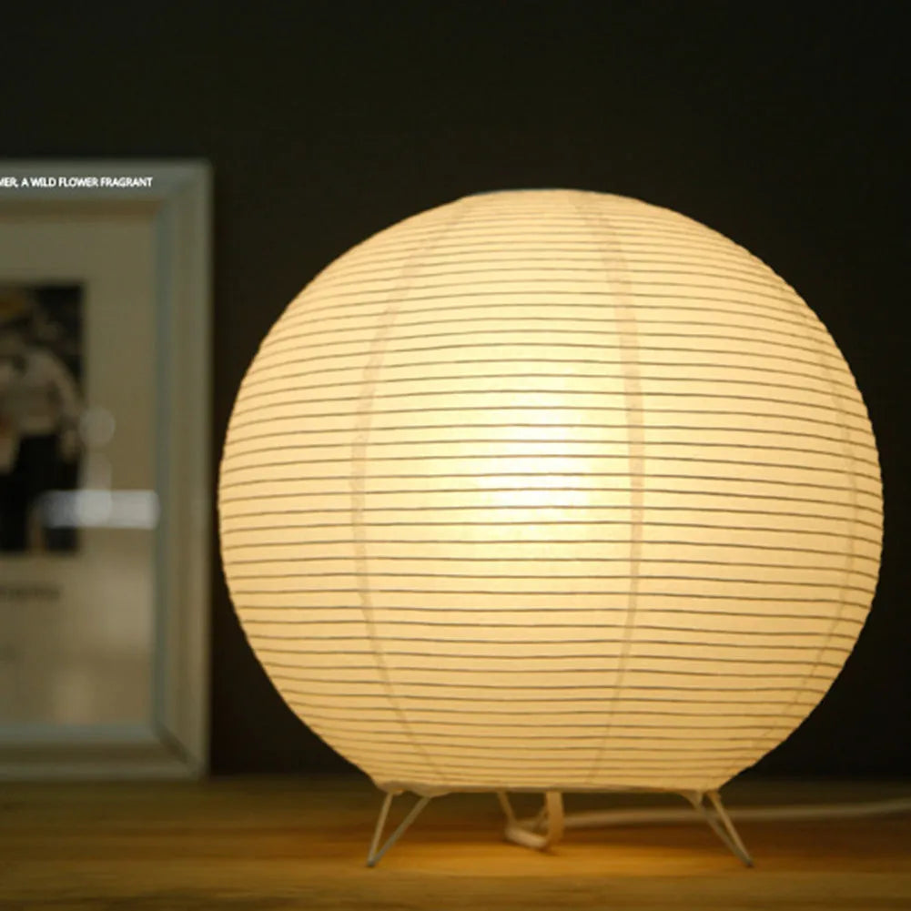 White traditional rice paper table lamp with E14 bulb holder on wooden desk