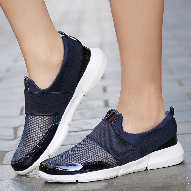 Women's low-top blue mesh sneakers on a white background.