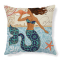 Square linen cushion cover with a detailed blue and green sea turtle print, shown on a grey sofa.