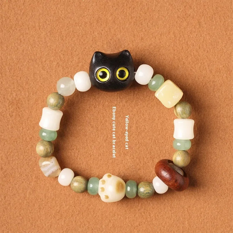 Hand-woven bracelet with sugar cat's paw design combining bodhi seed, jade and ebony wood