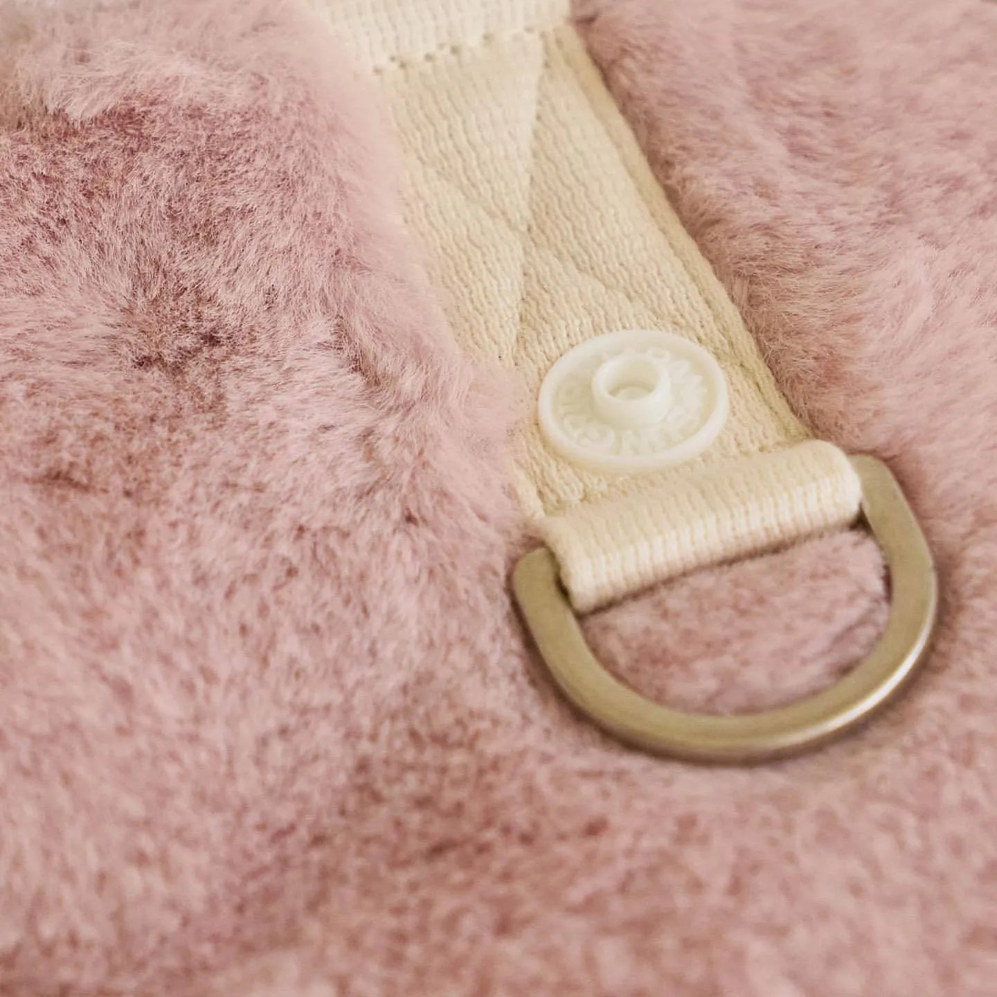 Light pink dog winter coat showing casual style and secure fastening