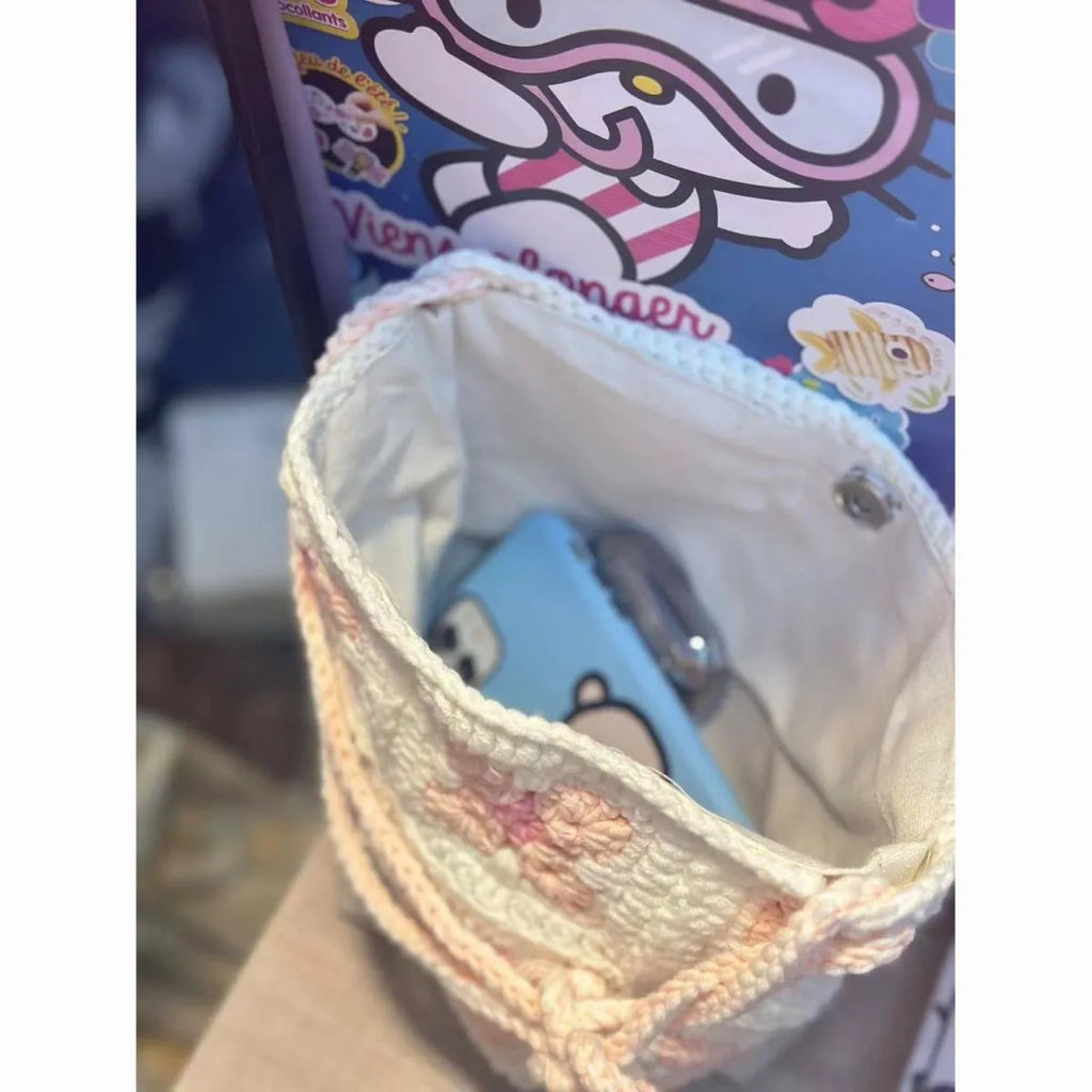 Handmade cotton crochet handbag with pink cherry blossom design and magnetic buckle