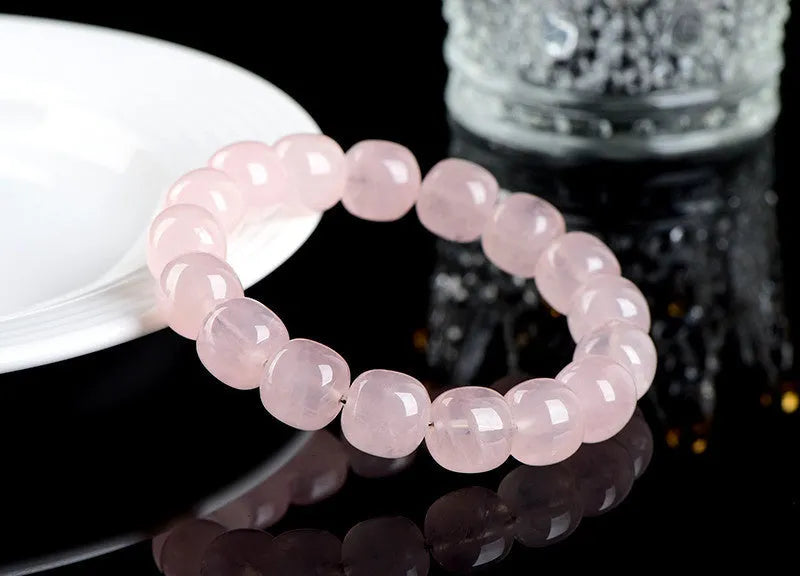 Pink bamboo and crystal barrel bead bracelet with geometric design measuring 11mm to 12mm