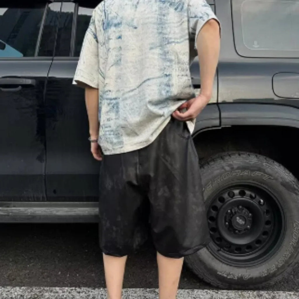 Men's loose fit round neck T-shirt with a printed Korean style design on solid colour fabric.