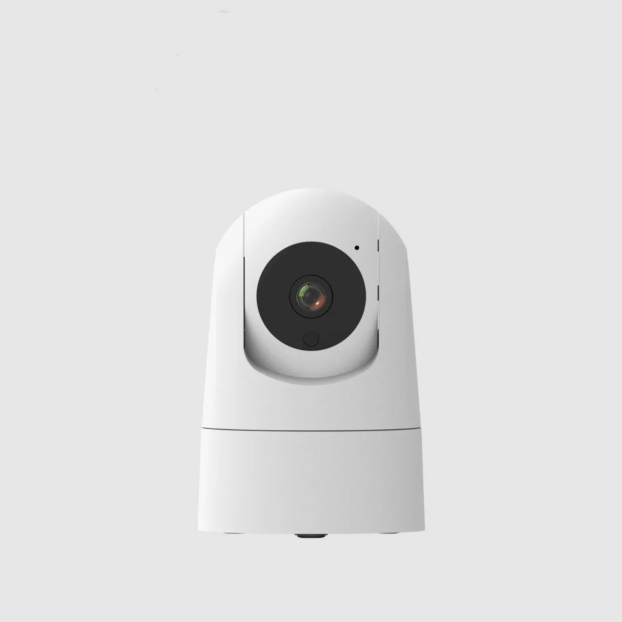 White indoor 5G security camera with tilt head on a desk next to EU UK US power plugs.