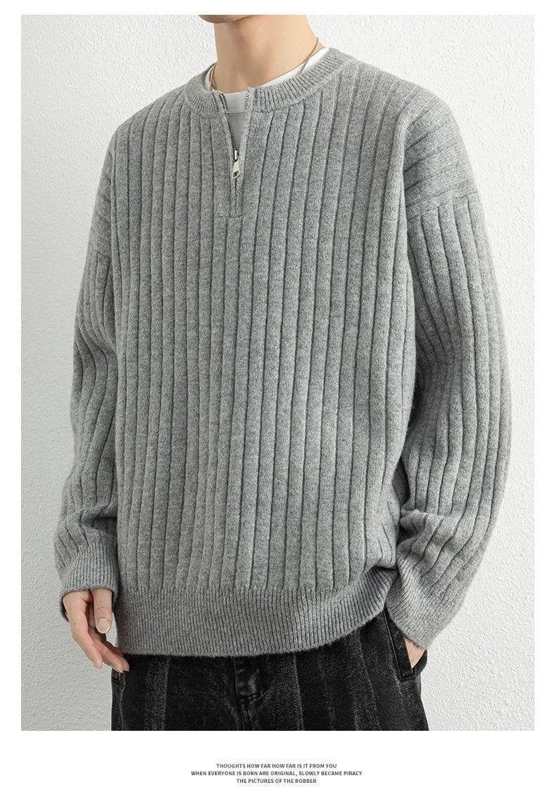 A grey men's loose-fit half-zip sweater with a textured knit and long sleeves.