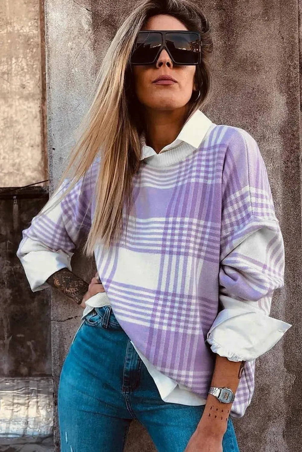 Lilac and white plaid print loose sweater with long sleeves and ribbed trim on cuffs and hem.