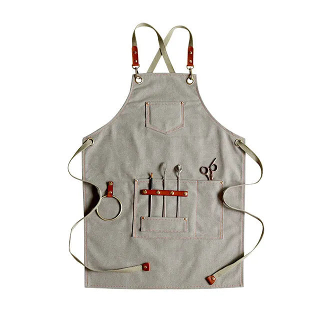 Canvas apron with cross-strap design in camel colour for café work and baking