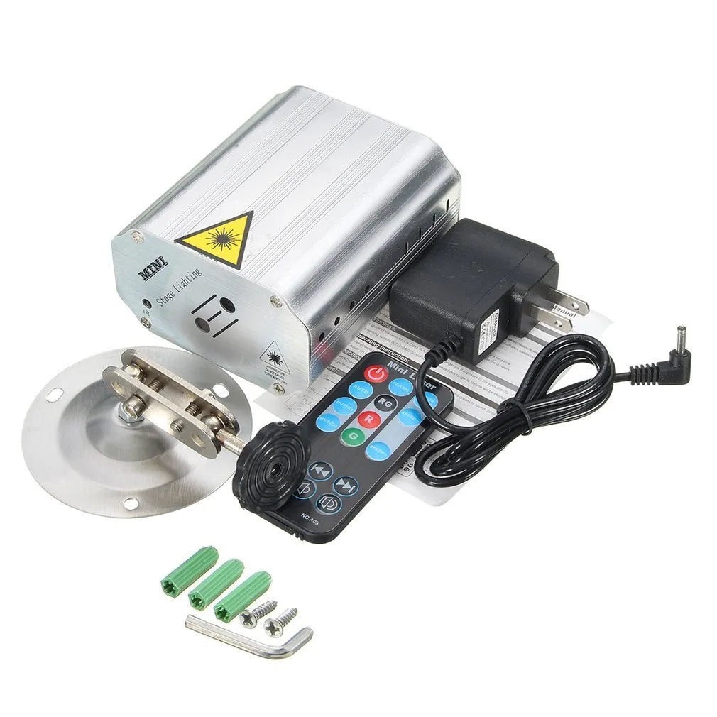 JC-24 dual laser light emitting red and green patterns against a dark indoor background with voice control remote included