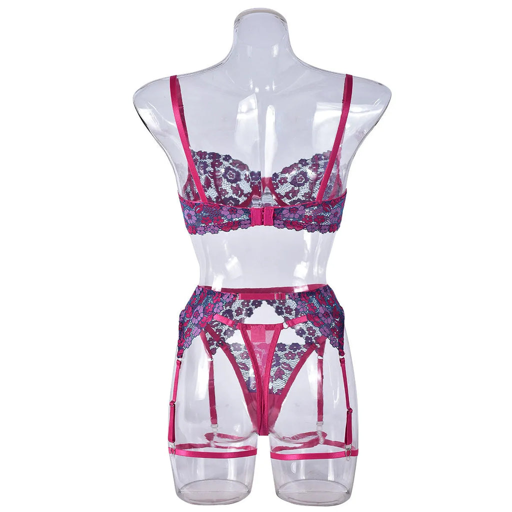 Rose red women's bikini set with floral embroidery on a white background.