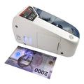 V31 foreign currency counting machine with purple light banknote verification and LED display on desk