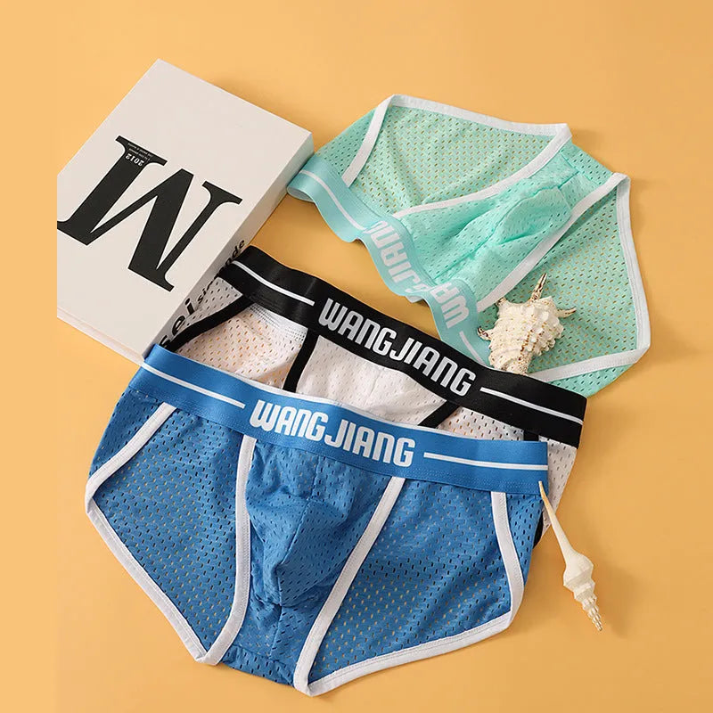 Men's solid colour ice silk triangle underwear briefs in breathable mesh fabric with quick-drying properties