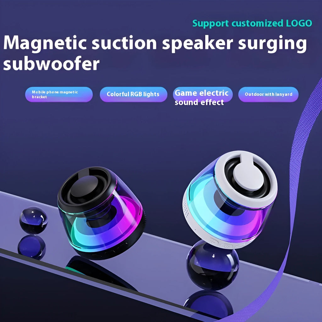 Black portable Bluetooth mini speaker with ambient light on a metallic surface, showing its magnetic base.