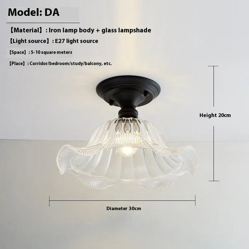 American retro single-head ceiling lamp with clear glass shade showing exposed filament style