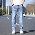 Tapered thin stretch denim trousers for business casual wear in light blue