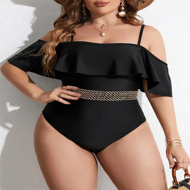 Black solid colour women's one-piece swimsuit on a hanger, polyester fabric, for swimming.